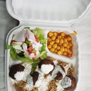 a tray of food on a bed