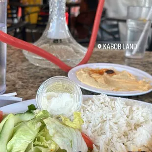 Hookah, chicken kabob dish, and hummus.