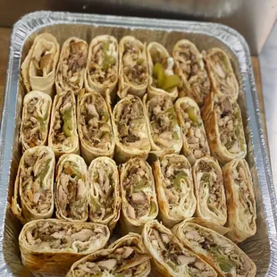 a tray full of wraps