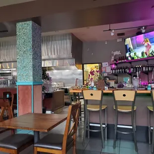 a restaurant with tables and chairs