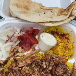 a tray of food on a picnic table