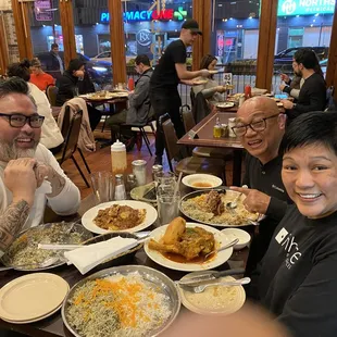 Big smiles and even bigger platters of delicious food!