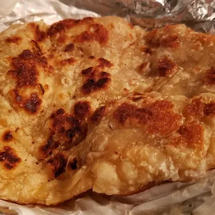 Parotta that comes with veg salna ($12), vegan by default. Decent, but thick &amp; doughy. Not flaky, thin.