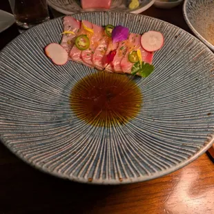 Hamachi Carpaccio. $22. Japanese yellowtail, yuzu tobiko, ponzu, kaffir lime oil, yuzu kosho, serrano peppers.