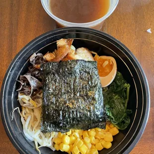 Ramen - broth in a separate container - Yes, that is nori seaweed paper on top!