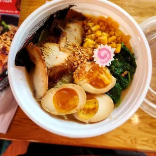 a bowl of ramen with hard boiled eggs