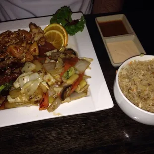 Hibachi chicken and steak with veggies and fried rice.