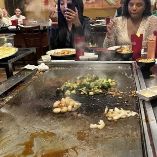 a woman taking a picture of the food