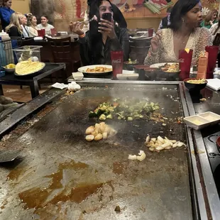 a woman taking a picture of the food