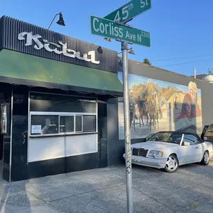 a car parked in front of the restaurant