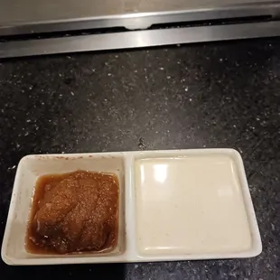 Ginger sauce on the left, yum yum sauce on the right.