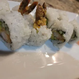 a plate of sushi rolls
