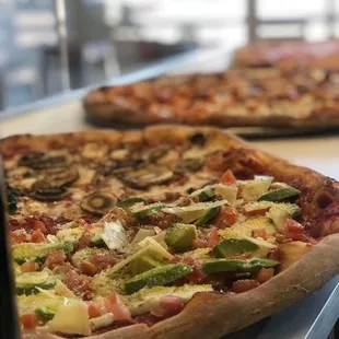 Fresh avocado, fresh mozzarella, chopped tomato, shaved provolone and olive olives