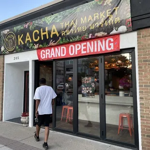 a man walking in front of the store
