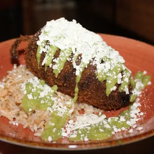 The Vegetable Relleno is made with poblano pepper, asadero, rice, avocado salsa, &amp; cotija cheese.