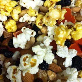 All Natural Navajo Grown Popcorn Trail Mix with plain and lightly caramelized popcorn, papaya, apricots, blueberries, walnuts and almonds.