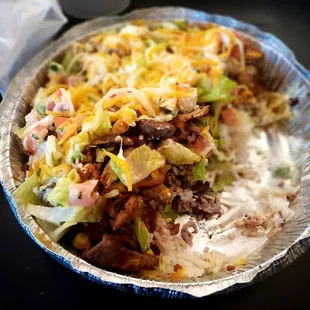 Bowl: white rice, lettuce, sour cream, corn, cheese, pico de gallo, black beans  chicken, steak, shrimp