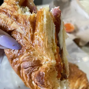 a hand holding a pastry