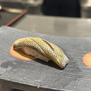 a piece of sushi on a plate