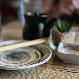 chopsticks and a bowl on a table