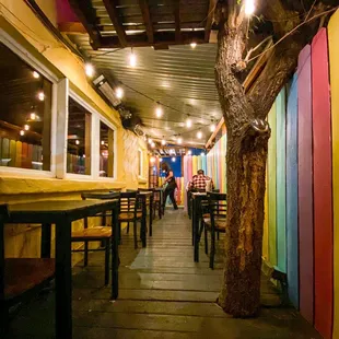 a restaurant with colorful walls and tables