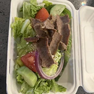 Greek salad with gyro meat. A little bit sparse for a $16 salad. There is literally, two tomatoes and one olive.