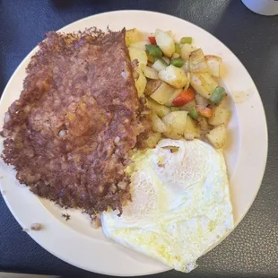 Corned beef hash with eggs over medium