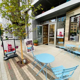 tables and chairs outside a cafe