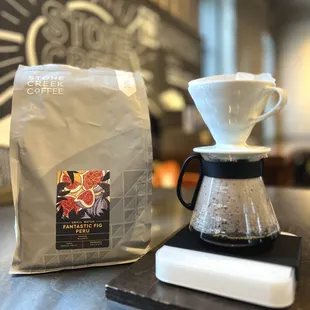 a coffee maker and a bag of coffee