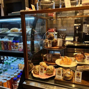 a display case filled with pastries