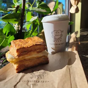 Biscuit with egg and provolone and short cappuccino