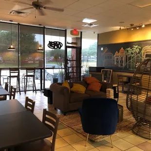 a coffee shop with tables and chairs