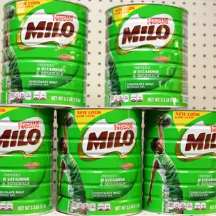 a stack of milk cans on a shelf