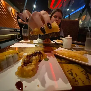 a woman eating sushi