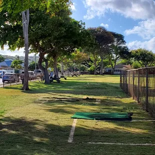 There are picnic tables scattered around the Kahala Community Park.