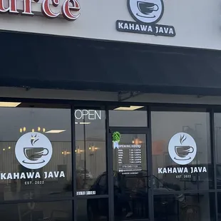 the entrance to a coffee shop