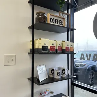 a shelf of coffee and coffee beans