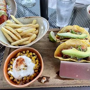 Carne Asada Tacos with elote (corn) and papas fritas. Very good!