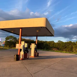 a gas station with a sky background