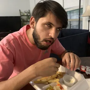 Person eating shawarma