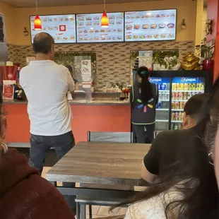 Menu and people waiting.