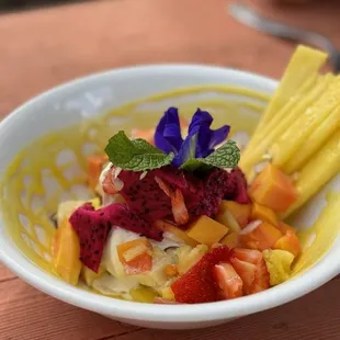 Ice cream with bananas, strawberries, papaya, dragonfruit, pineapple, and lilikoi sauce ($7?)