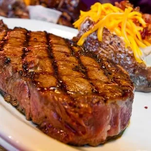 Saturday Night Steak Night $10.95 loaded baked potato, house salad and steak
