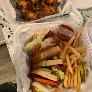 Supposedly a Turkey BLT &quot;loaded with bacon&quot; but wasn&apos;t and some dried cold wings..