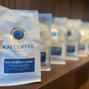 coffee bags lined up on a shelf