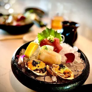 Omakase with shigoku oysters topped with masago and uni, ono, and bluefin tuna. Delicious