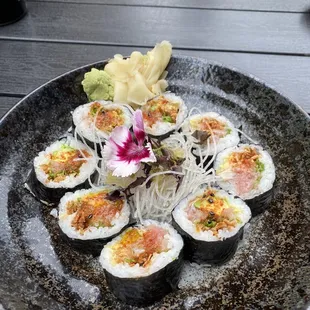 a plate of sushi on a table