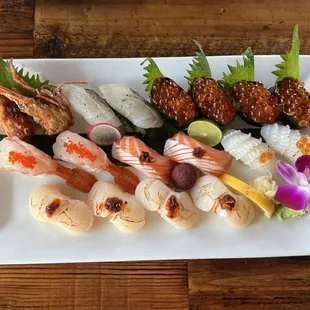 Madai (red snapper), ikura (salmon egg), ama ebi (sweet shrimp), sake toro (salmon belly), ika (squid), hotate (scallop)