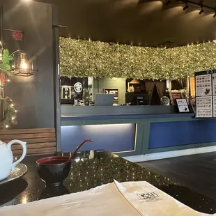 the front counter of a japanese restaurant