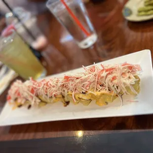 a long roll of food on a plate